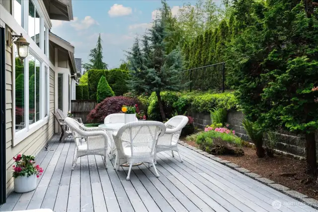 A place for relaxation this manicured, completely fenced backyard provides a private oasis