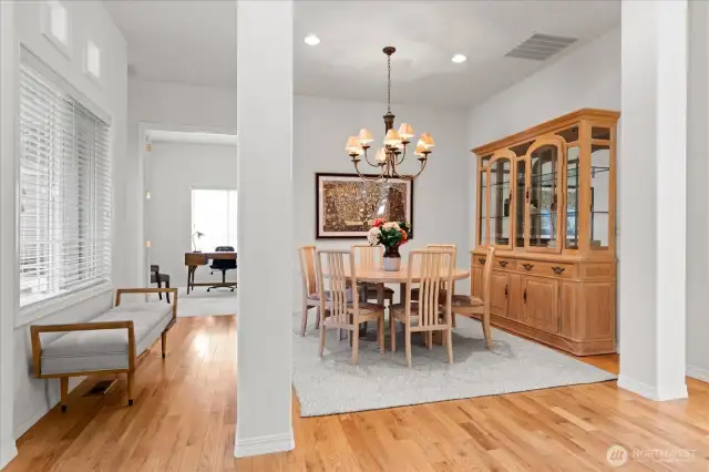 Elegant dining room for entertaining with designer chandelier, offers space for a large table and China hutch
