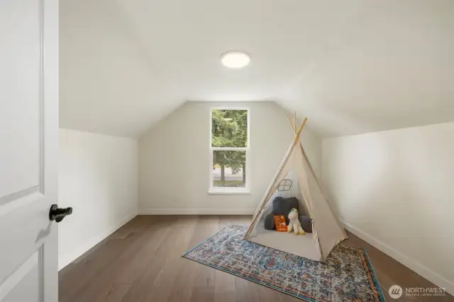 Spacious guest bedroom that can easily double as a home office, nursery, or hobby space