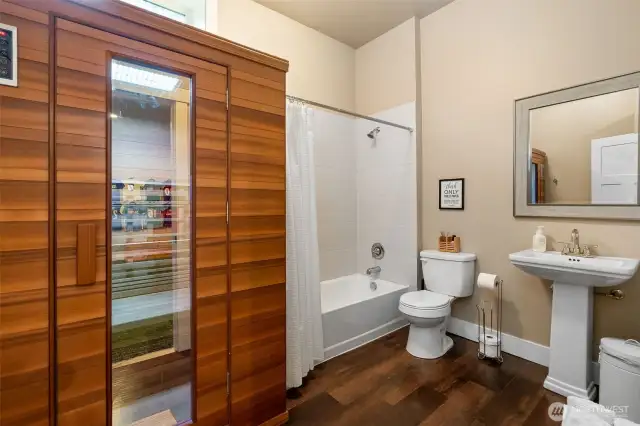 A little luxury goes a long way in this basement bathroom, complete with a two-person sauna to melt your stress away. There’s also a bathtub with a shower surround for flexibility, and a simple pedestal sink that keeps things elegant and easy.