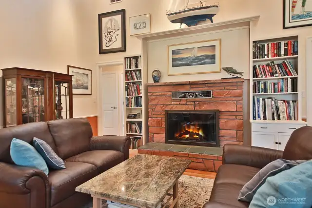 Expanded living room centred around the original brick fireplace.