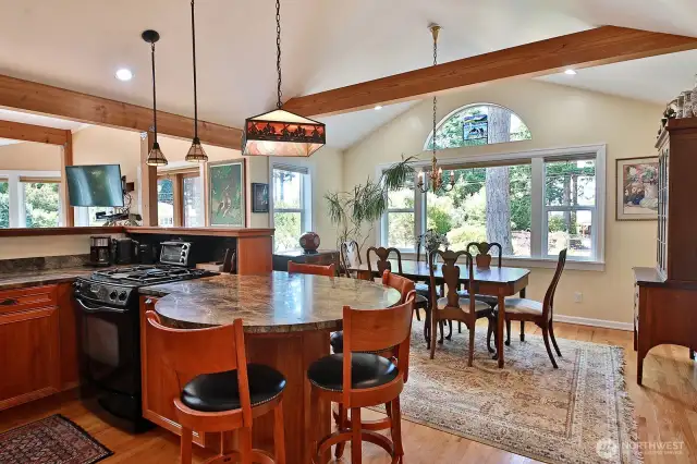 The kitchen opens into the dining area and living areas