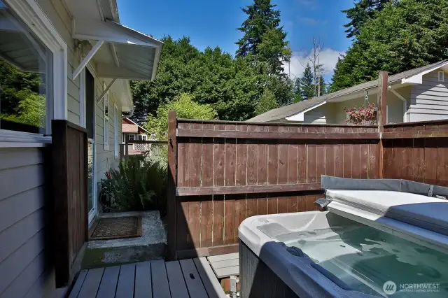 The hot tub off the Primary Bath has a privacy fence for those who bath in the buff.