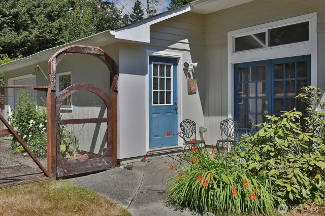 Entry to the Shop space. There is a single car garage to the left and two bays to the shop.