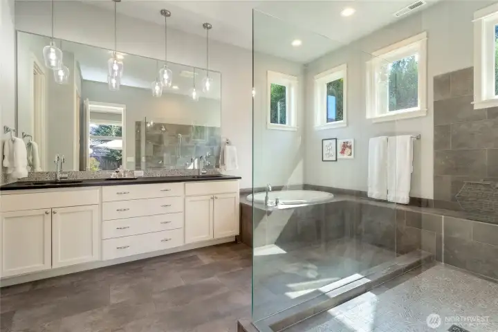 Primary bathroom with double sink vanity, soaking tub & walk in shower