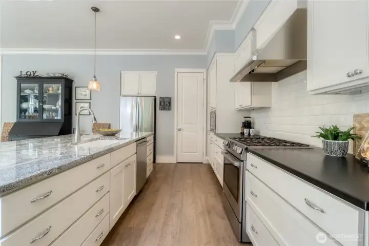 Kitchen with Granite countertops & walk-in pantry
