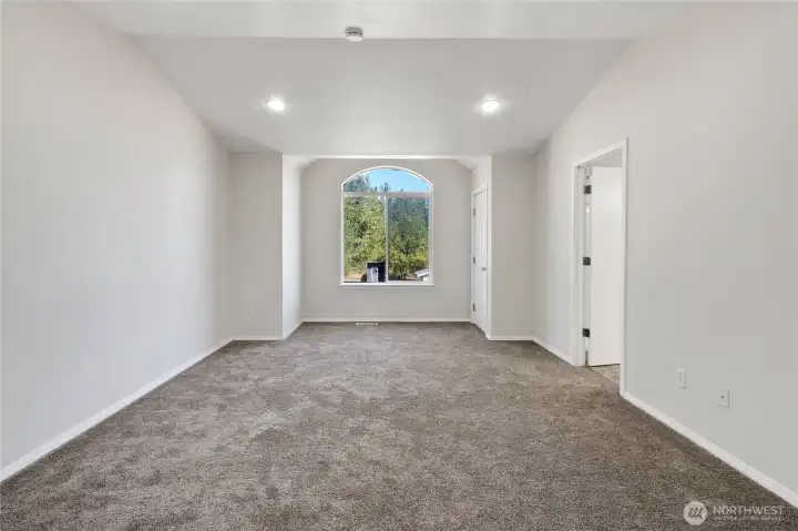 Primary with deck off front of home and full primary bath