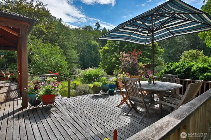South facing cedar deck looks out upon your gardens. There is so much privacy here!