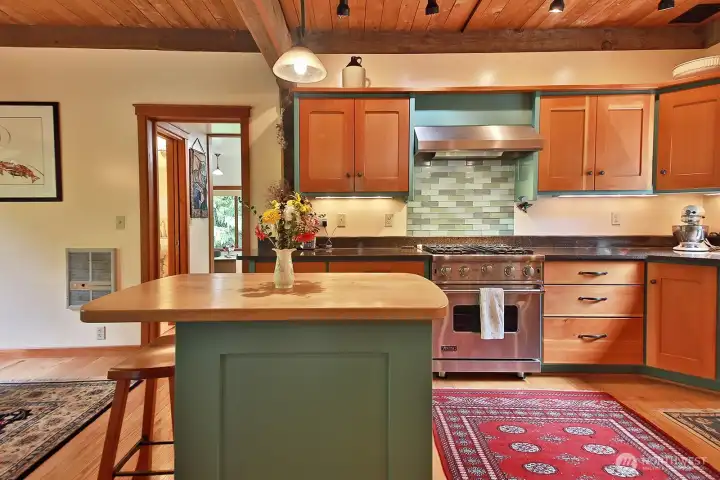 Let's go see the Family Room (could also be a main level Primary) and Full Bath through the doorway straight ahead.