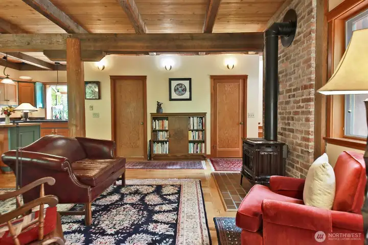 Your back is to the sweet Reading Nook (a favorite spot to cozy up or take a nap). Door to the left is the entrance to the laundry room. Door to the right is a closet. Let's go upstairs. A glimpse of the stairs is seen to the right of the closet door.