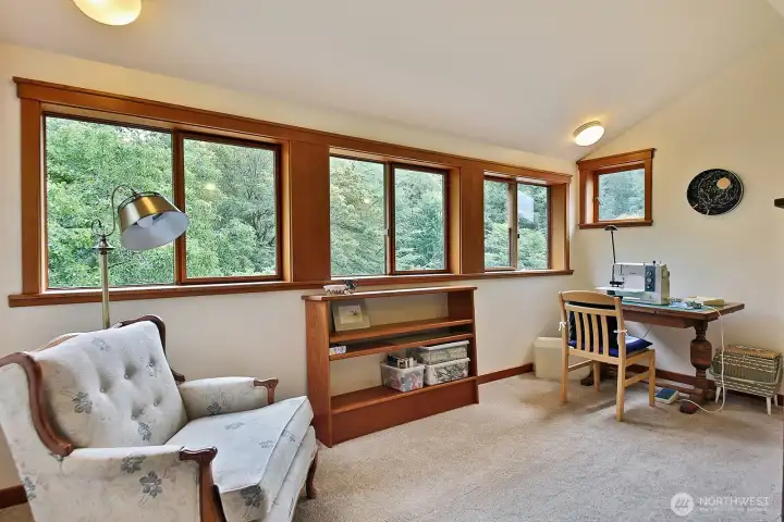 This is the office, currently used as a sewing room. This room looks out upon the eastern side of your home.
