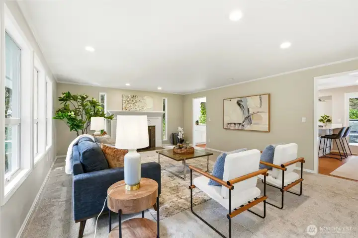 Bright Living Room with Fireplace and Large Windows in Forest Park Everett