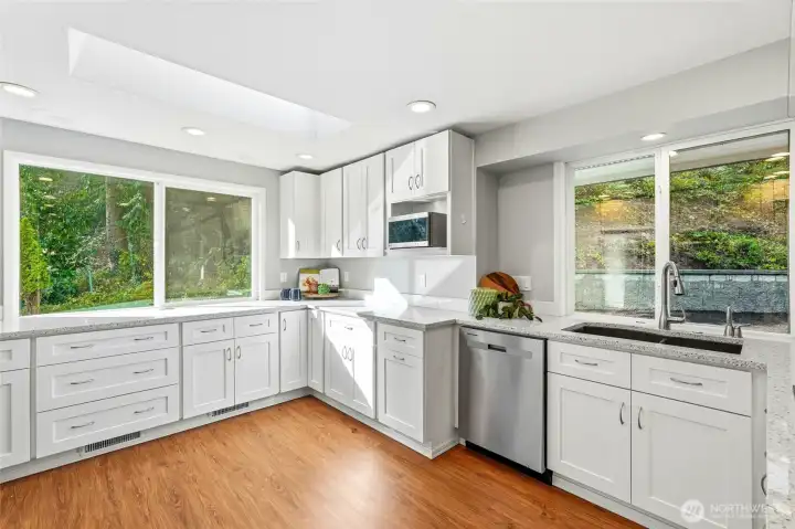 Spacious Kitchen with Abundant Cabinetry, Garden View Windows and Stainless Appliances