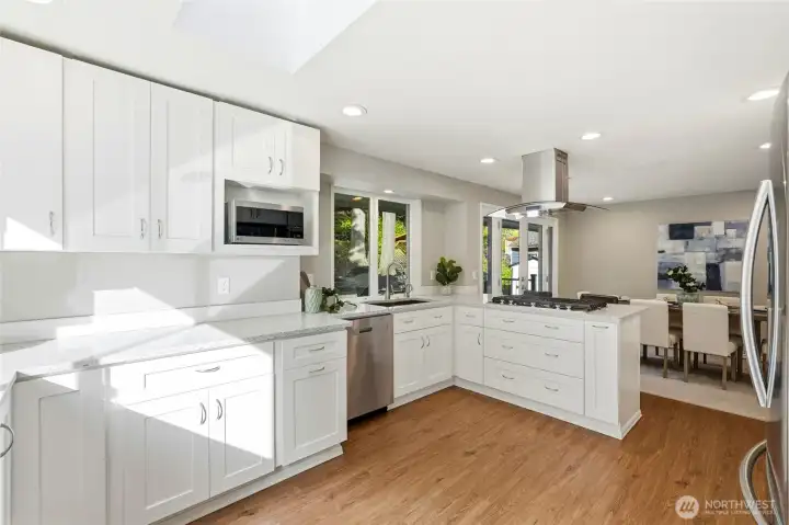 Updated Kitchen with Quartz Countertops, Stainless Appliances and Skylight