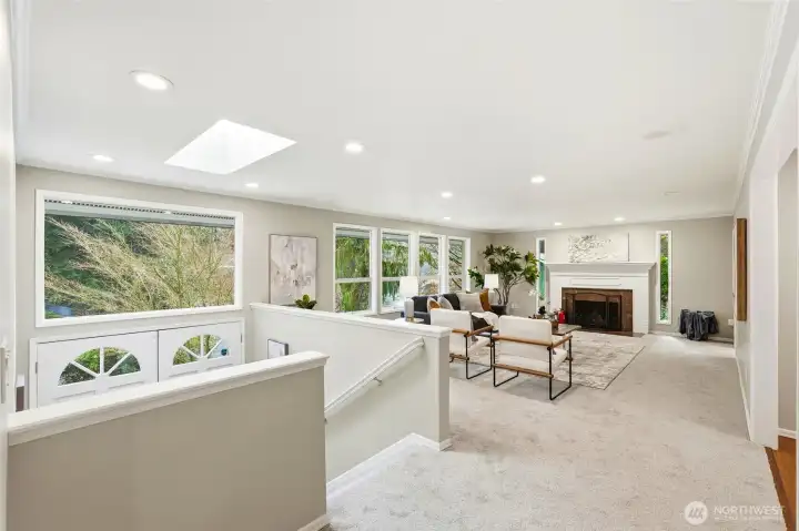 Spacious Living Room with Skylight, Large Windows and Fireplace in Forest Park Everett