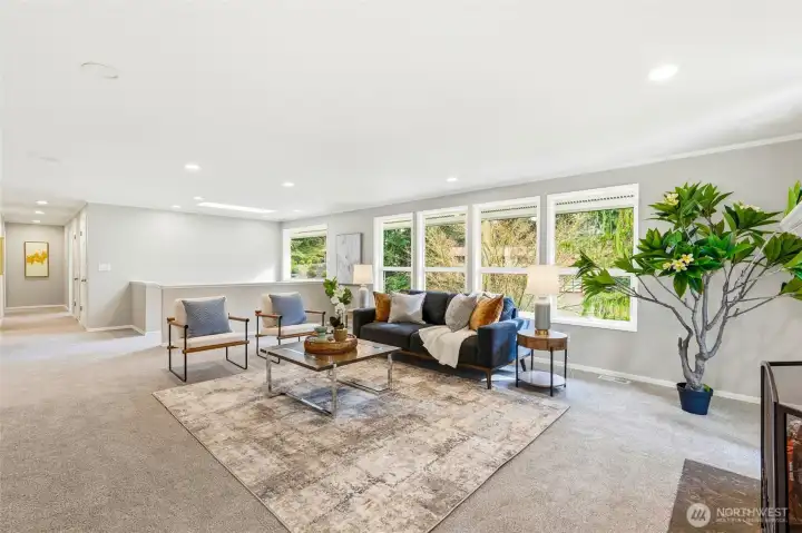 Spacious Open Living Area with Wall of Windows and Private Treed Views