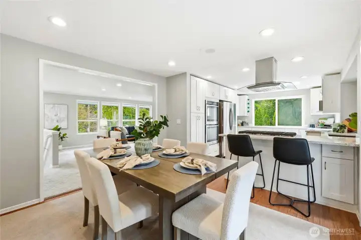 Open Dining and Kitchen Layout with Island Seating and View to Living Room