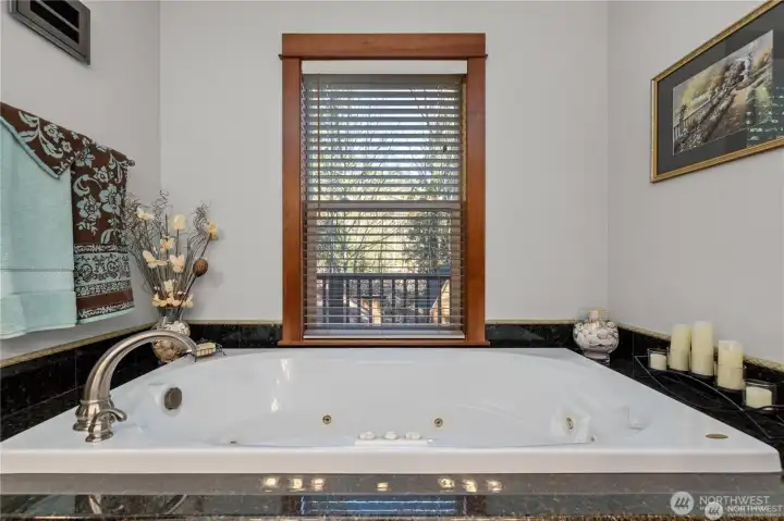 The primary jetted tub is the perfect place to unwind after a long day