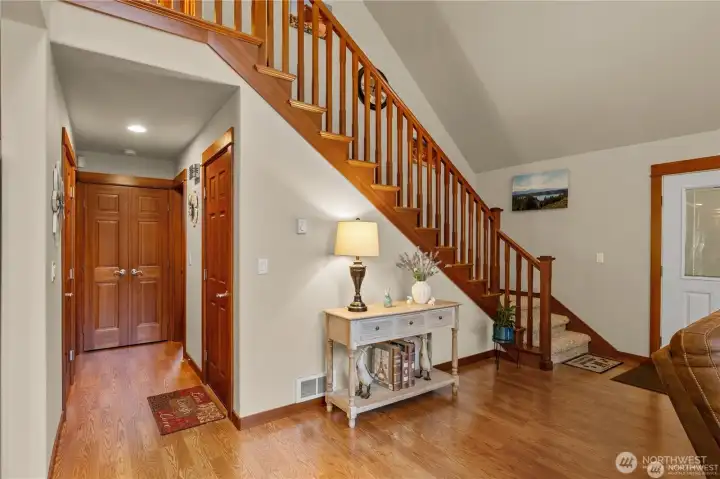 The door under the stairs leads down to the lower level/garage