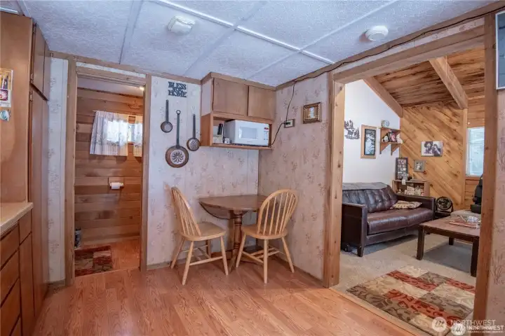 From the entry, the bathroom is to straight ahead and the living room is off to the right