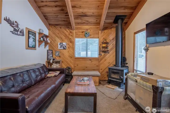 Guest house living room with cozy wood-burning fireplace