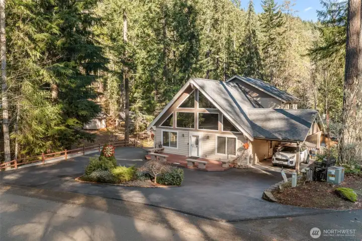 There's a looped drive off the street that also continues around to the level level