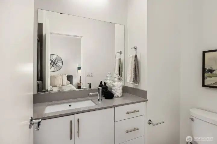 Lovely quartz counter top in the Primary bath.