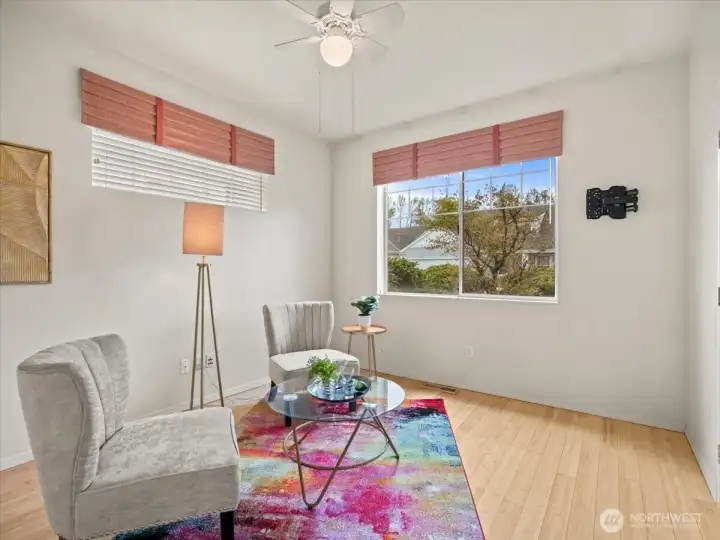 Generous den featuring French glass doors offering flexibility as a media room or possible third bedroom.