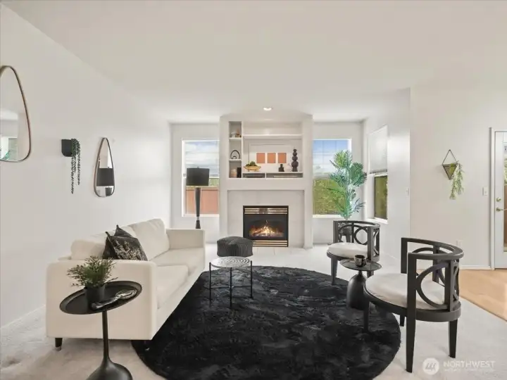 Living room features a gas fireplace enhanced by windows that frame the space with natural light.