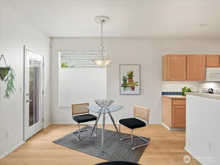 Dining area is set on Bamboo flooring offering both style and easy maintenance.