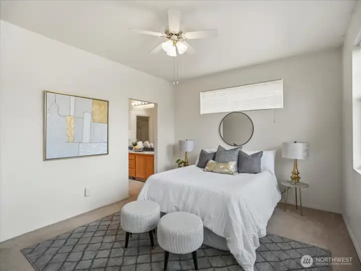 Generously sized primary suite designed to easily fit a king size bed with room to spare.