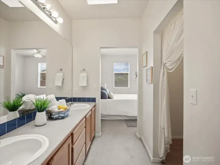 Convenient walk-in closet located just off the primary bath for easy access and organization.