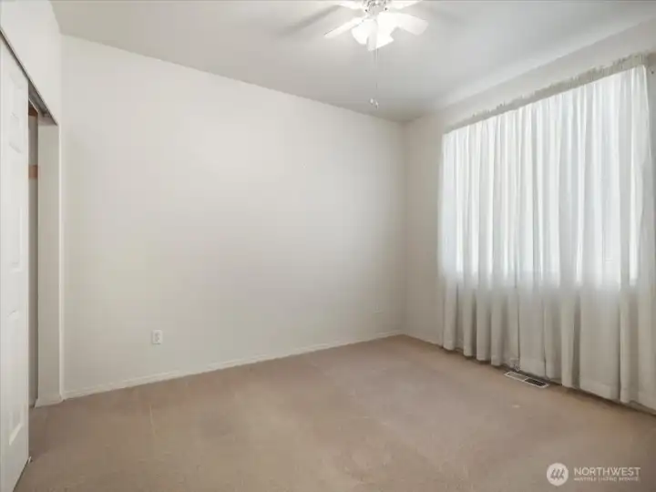 Another view of the second bedroom and closet space.