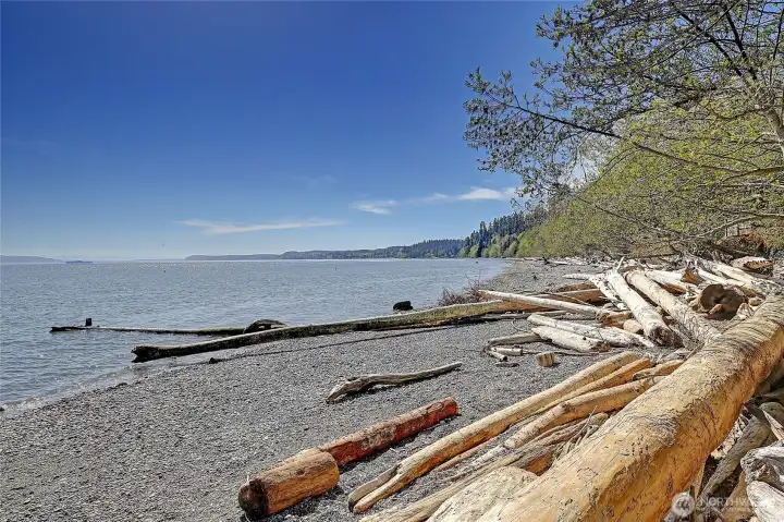 Private beach access leads to this scenic shoreline, perfect for relaxing and enjoying the water.