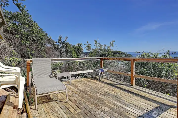 Private deck located near the beach offers a great space to relax and take in the surroundings.