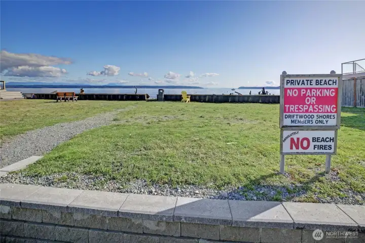 Nearby community beach access provides additional space to enjoy the waterfront, just a short distance from the property.