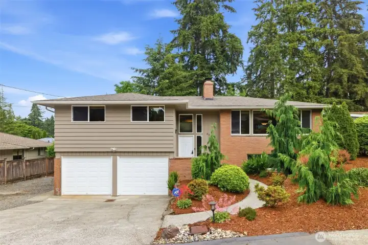 Beautiful landscaped for great curb appeal. Two car garage, driveway parking and 3 street angle parking spots.