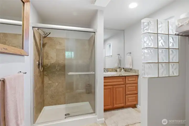 Primary suite with step in shower.