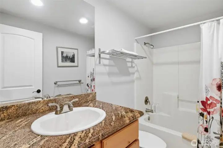 Main upstairs bathroom with bathtub.