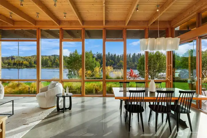 Dramatic floor-to-ceiling walls of glass in the dining/great room.