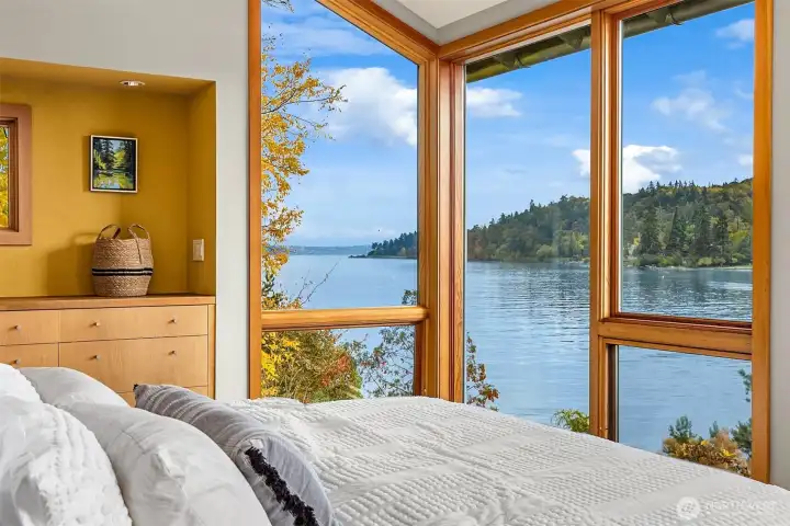 Breathtaking view from the primary suite with handcrafted custom built-ins.