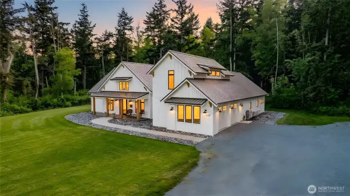 Exquisitely designed, warm and inviting modern farmhouse style home on 5 pristine acres close to ferry and beach.