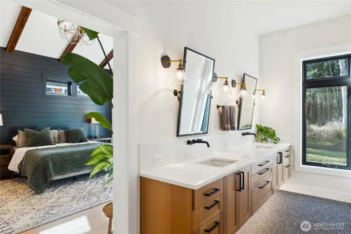 Primary ensuite bathroom with floating double sink vanity, heated floors, zero entry walk-in shower with heated floors and heated towel bar. Only the best for you!