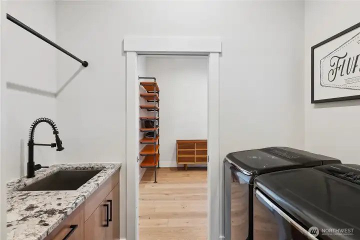 Laundry room with utility sink and lots of storage space!