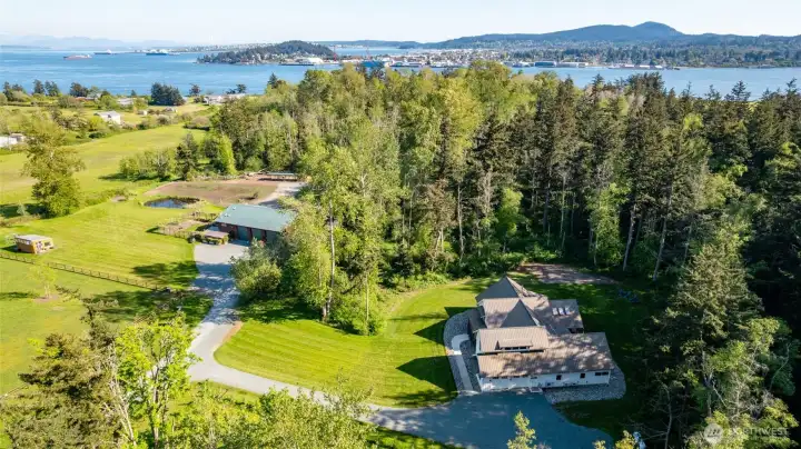 Another nice aerial view shows the beautiful, private setting and proximity to the water and Anacortes (in the distance).