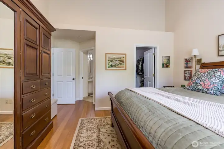 Alternate view of the main-floor primary suite showcasing the layout and closet access.