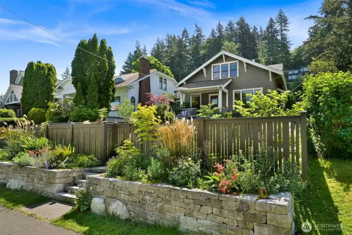 The yard has been completely re-landscaped with a striking dry stack retaining wall, pathways, raised beds and new fencing The yard has been completely re-landscaped with a striking dry stack retaining wall, pathways, raised beds and new fencing