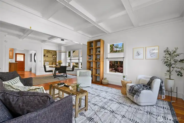 The living room features period details like fir wood floors and doors as well as gorgeous coffered ceilings. The living room features period details like fir wood floors and doors as well as gorgeous coffered ceilings.