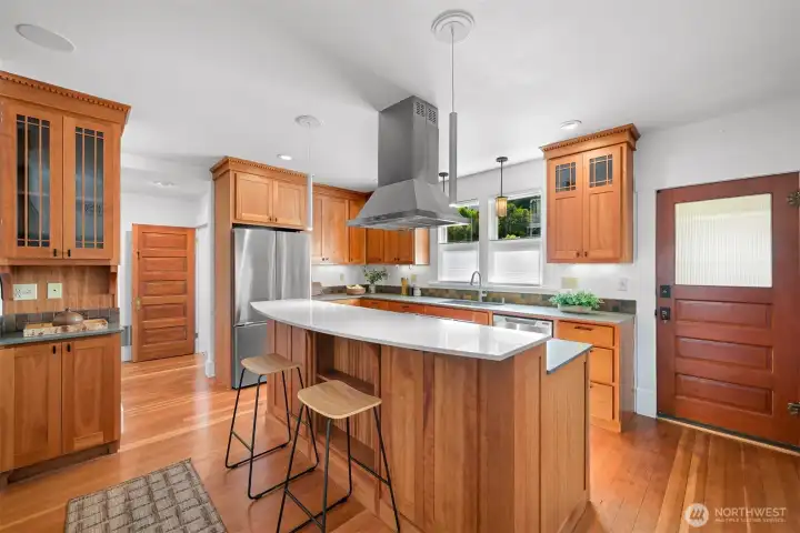 Timeless cherry cabinetry, solid surface Caesarstone counters and newer appliances make this kitchen a dreamy space to work in Timeless cherry cabinetry, solid surface Caesarstone counters and newer appliances make this kitchen a dreamy space to work in