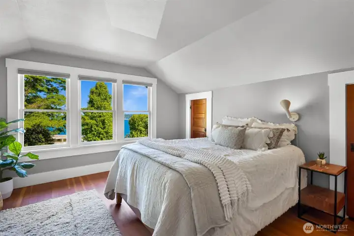 The en-suite primary suite is located on the second floor and features bay views and a gas fireplace (there is also a bedroom and full bath on the first floor) The en-suite primary suite is located on the second floor and features bay views and a gas fireplace (there is also a bedroom and full bath on the first floor)